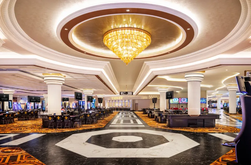 Casino floor at Caesars New Orleans with slot machines and table games