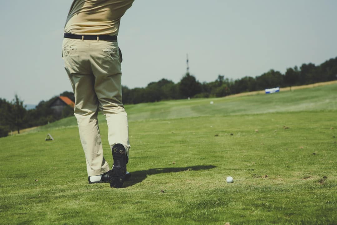 man playing golf, tags: liv - unsplash