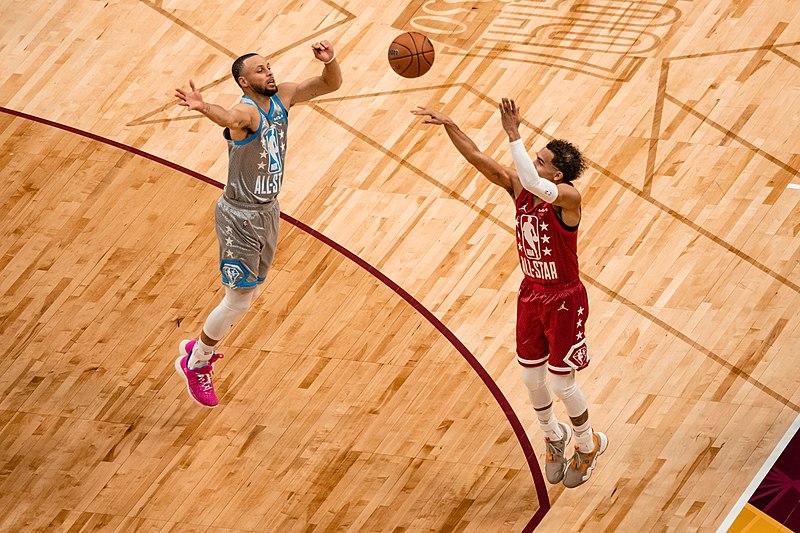 Three-point field goal - Trae Young shoots a three-point shot over Stephen Curry during the 2022 NBA All-Star Game, tags: implement max playoff - CC BY-SA