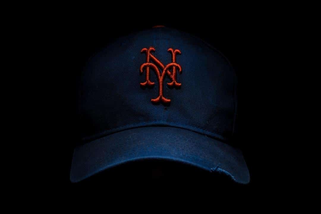 black and red New York fitted cap, tags: brett baty undergo surgery game - unsplash