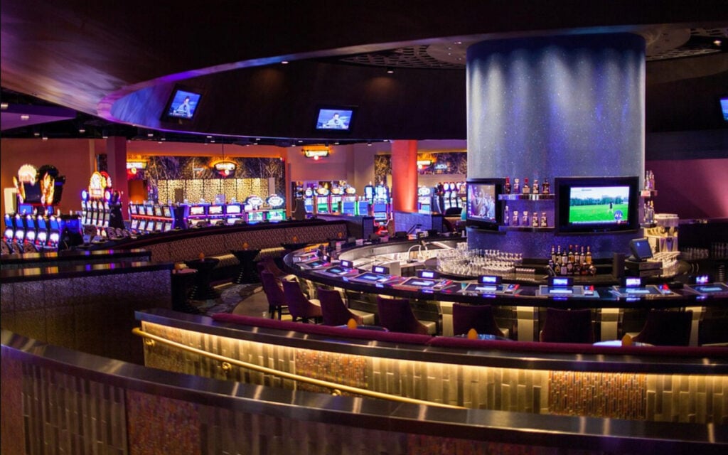 Inside Kickapoo Lucky Eagle Casino with slot machines and bar area in view
