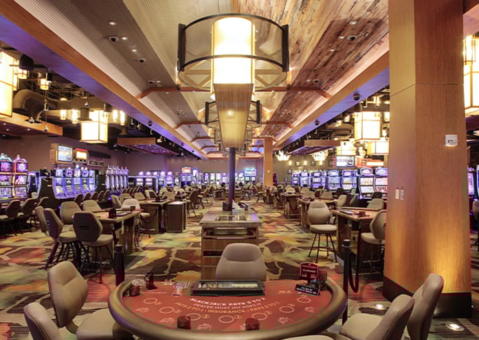 Casino floor at Kansas Crossing Casino and Hotel with slot machines and blackjack tables