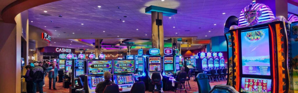 Shoshone Rose Casino floor featuring rows of slot machines and players