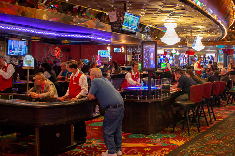 Busy Las Vegas casino floor with slot machines and players, a popular option for Utah residents seeking legal gambling