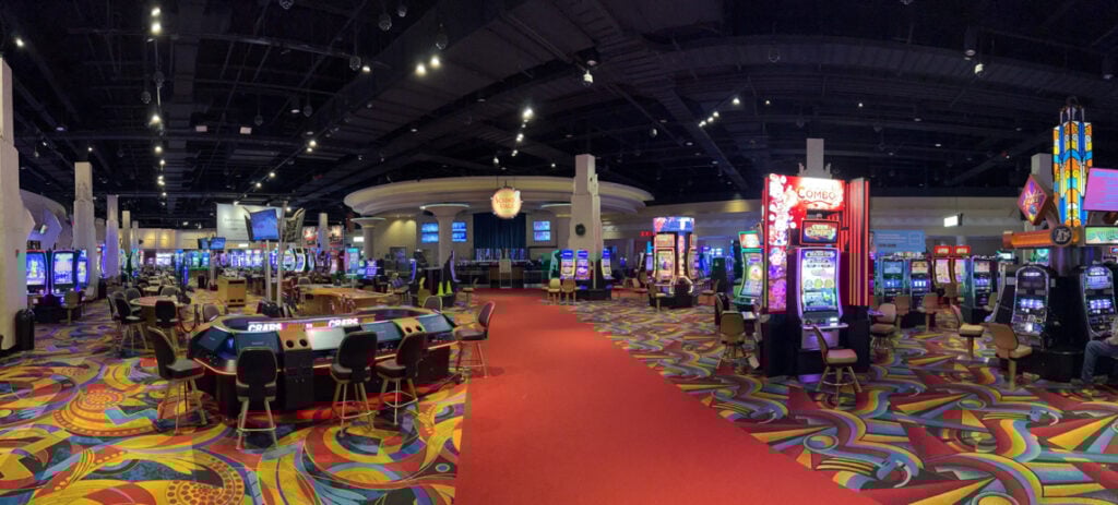 Inside Hollywood Casino Bangor showing rows of slots and gaming tables