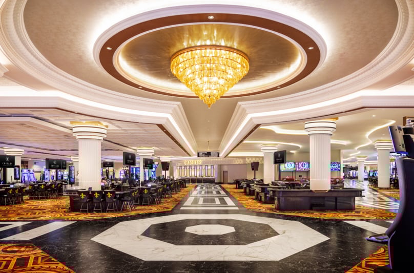 Casino floor at Caesars New Orleans with slot machines and table games