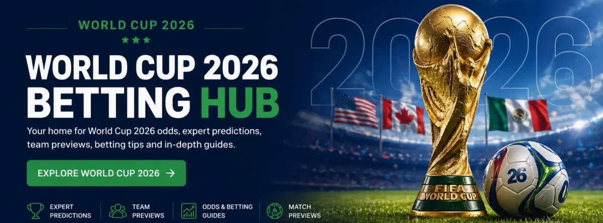 World Cup 2026 betting hub banner with bold title text, a golden trophy and soccer ball on a stadium field, national flags in the background, and a call-to-action button for guides and predictions.